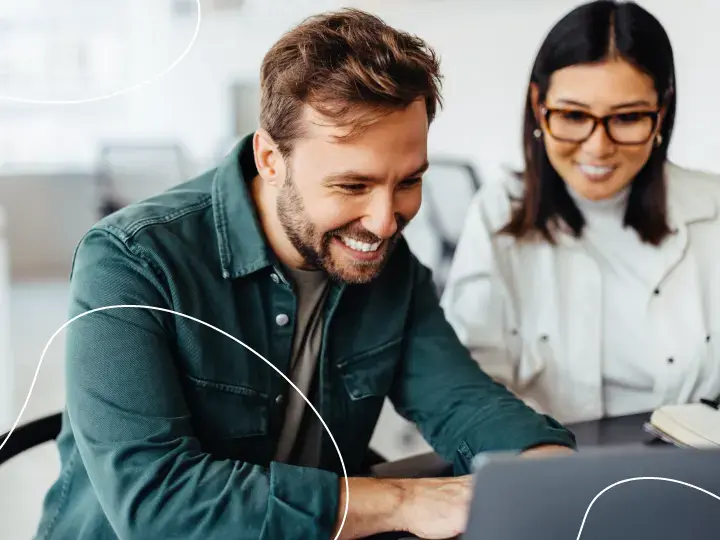 People smiling at laptop